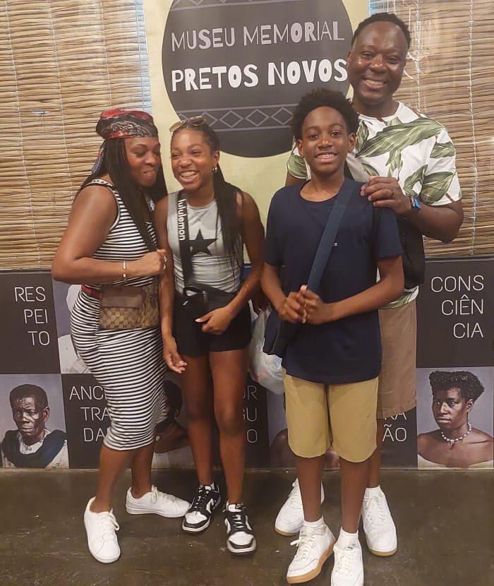 Family visiting the Pretos Novos Memorial (IPN) honoring Afro-Brazilian heritage